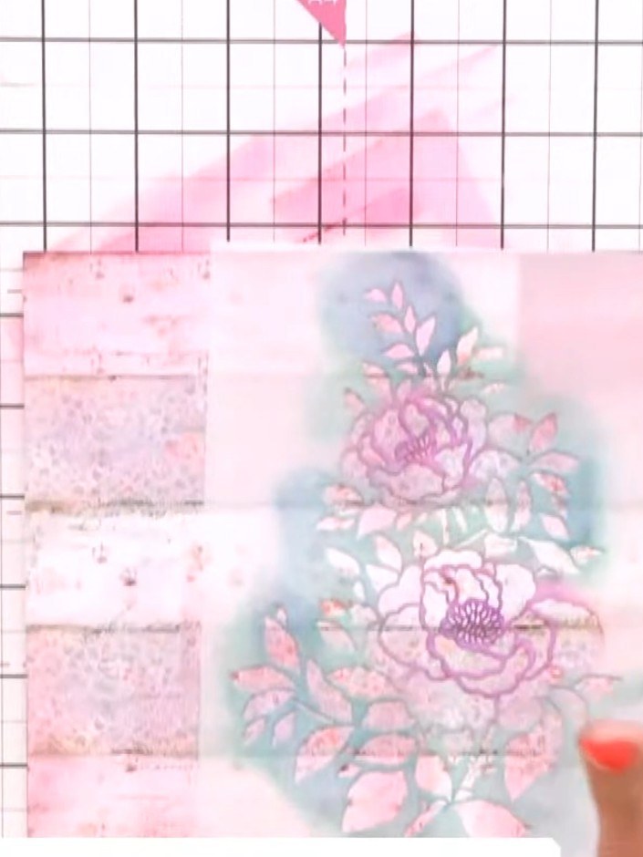 Step 3: Position the floral stencil over the centre of your patterned paper panel. Using a brush, lightly apply grey i