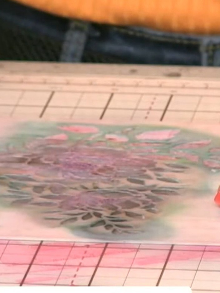 Step 5: Mount the stencilled paper onto a pink card base using adhesive. Smooth down firmly to ensure it is securely a