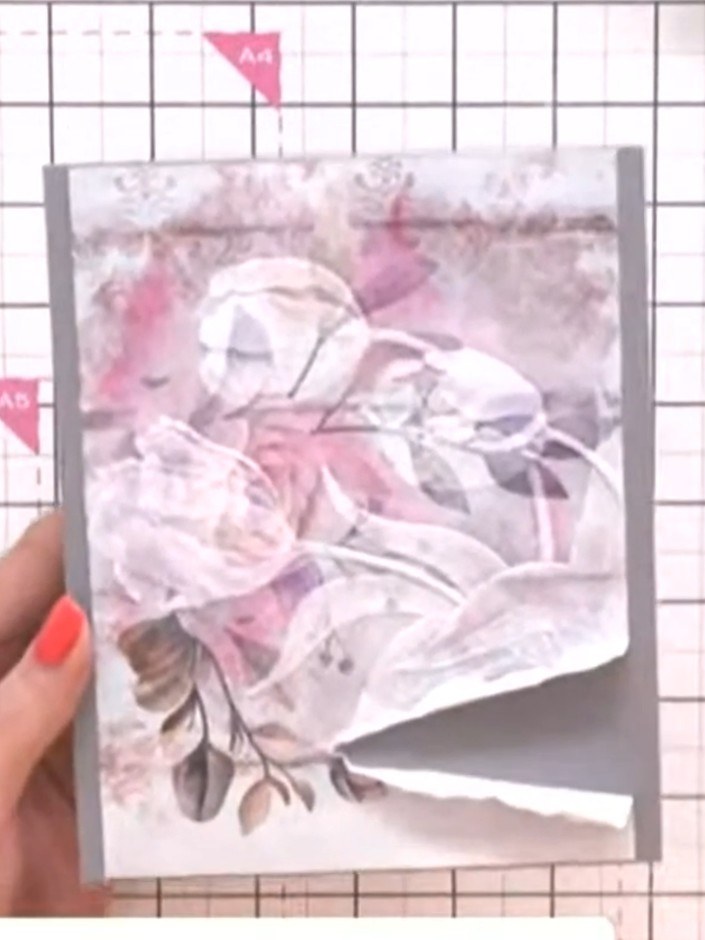 Step 2: Position the bird stamp off to the side of the painted mount, placing it towards the lower right area of the f