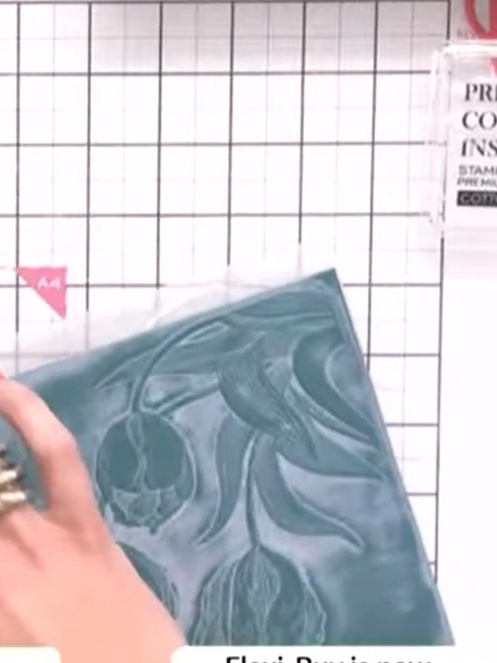 Step 11: Optional: Lightly swipe a black ink pad across the embossed design to add depth and coordinate with the overal