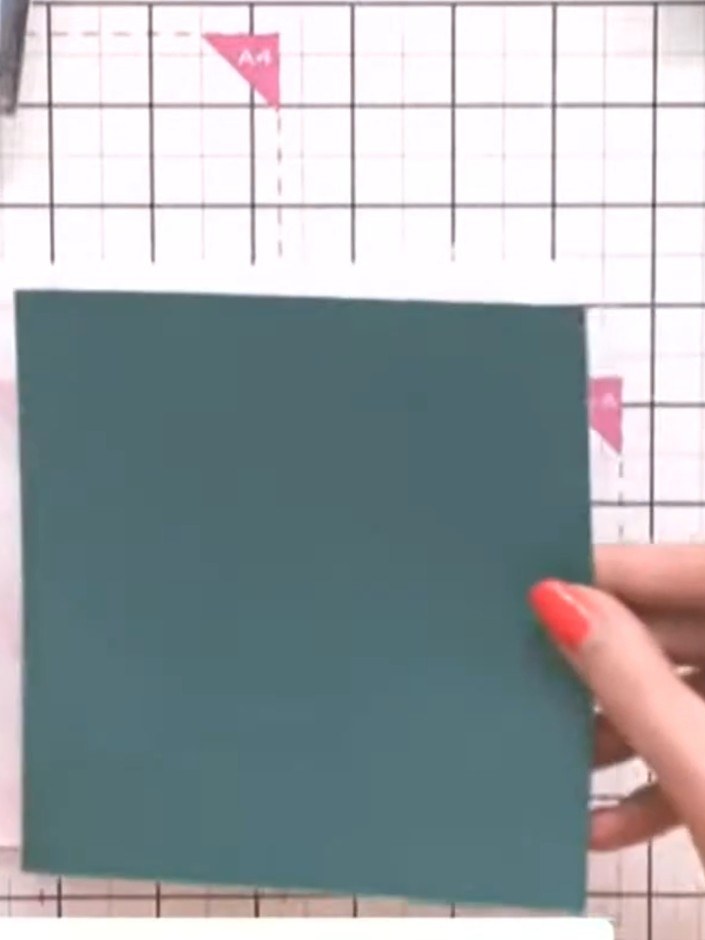 Step 3: Place the teal card into your embossing folder and run it through your die-cutting machine to emboss the flora