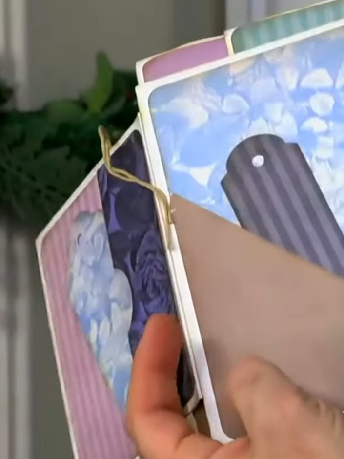 Step 4: Lightly sand the embossed edges of the card pieces to reveal the white core of the card stock beneath the colo