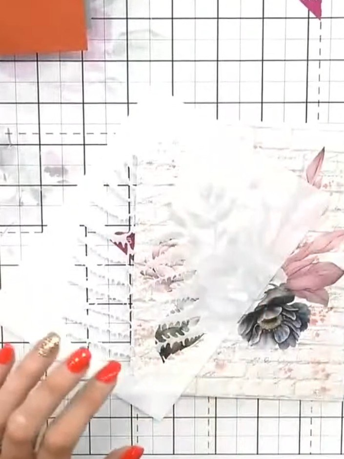 Step 2: Place the vellum sheet inside the Magnolia embossing folder and run it through your embossing machine to creat