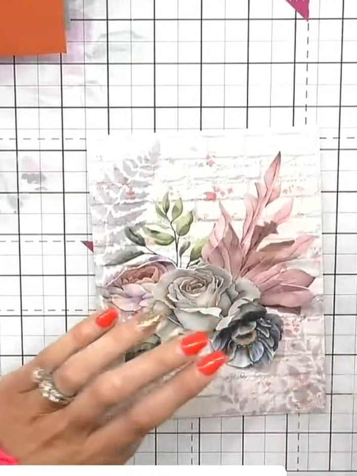 Step 5: Use the floral stencil with black distress ink to add small floral detail near the bottom of the painted mount