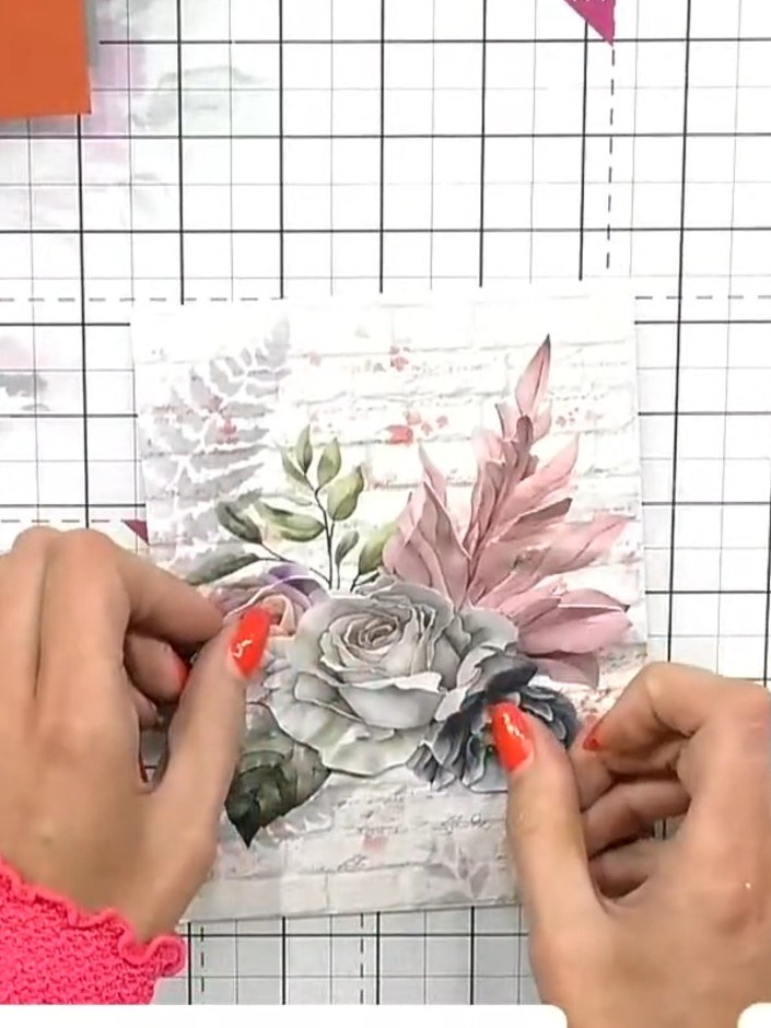 Step 7: Soften the edges of the fussy-cut floral element by gently tearing around the perimeter to create a more natur