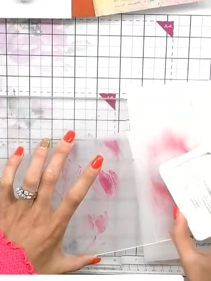 Step 2: Swipe the magenta ink pad across the surface of the Tulip embossing folder to apply colour to the raised desig