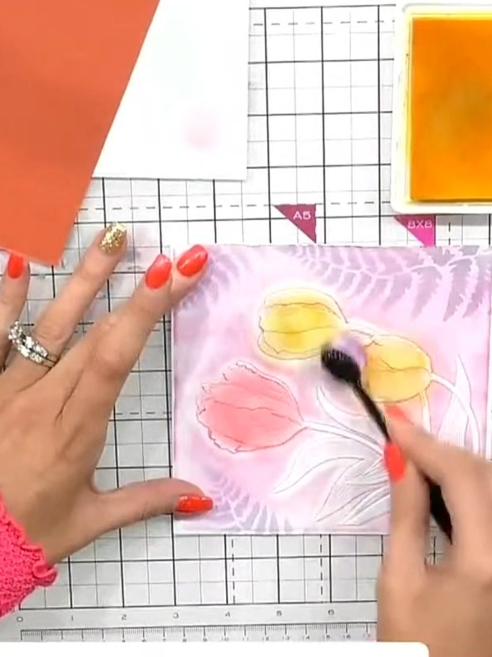 Step 7: Use blending brushes to add colour to individual flower heads on the embossed design. Apply small amounts of o