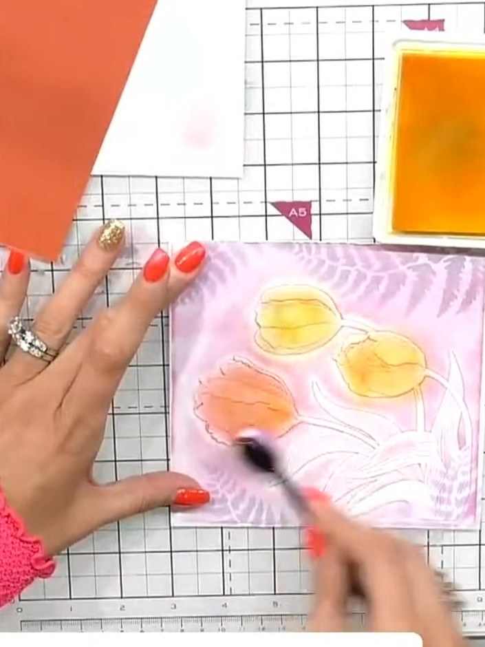 Step 8: Using a blending brush, apply green ink to the leaves on the embossed design. Work the colour gently over the 