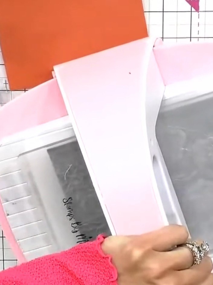 Step 3: Run the embossed card through your die-cutting machine to ensure a flat finish. This will help remove any curl