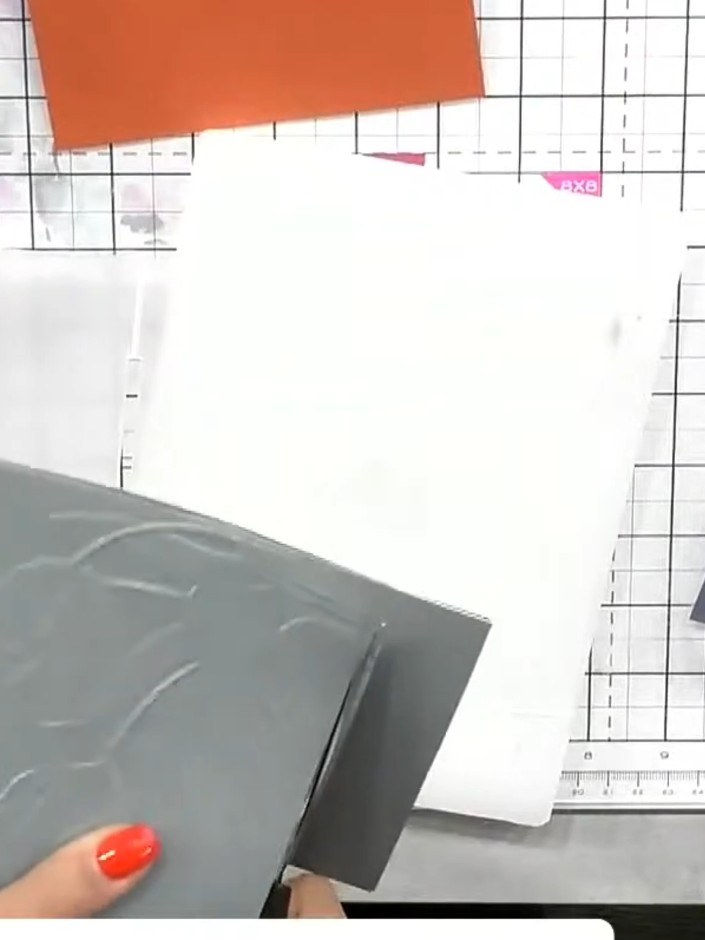 Step 5: Run the purple vellum sheet through the embossing machine with the tulip embossing folder to create matching e