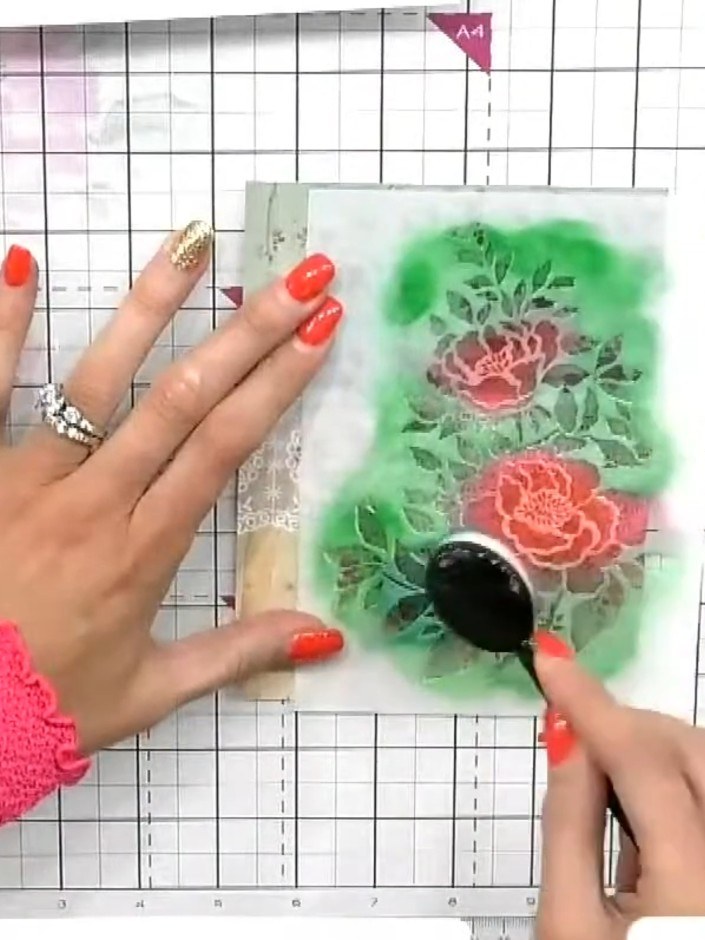Step 5: Allow the green and coral ink colours to blend naturally where they overlap on the stencilled floral design. U