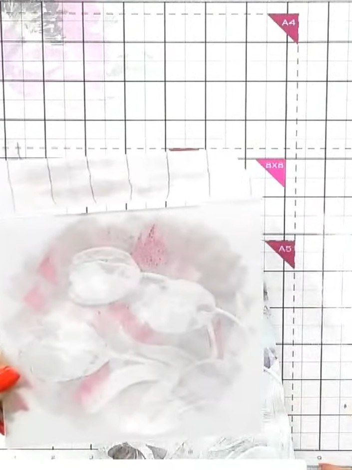 Step 7: Spray the inked embossing folder with water to activate the dye-based inks. This will help transfer the colour