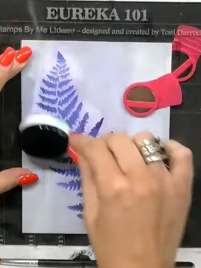 Step 8: Use a clean brush to pounce additional white ink around the fern stencil to enhance the feathered, floating ap