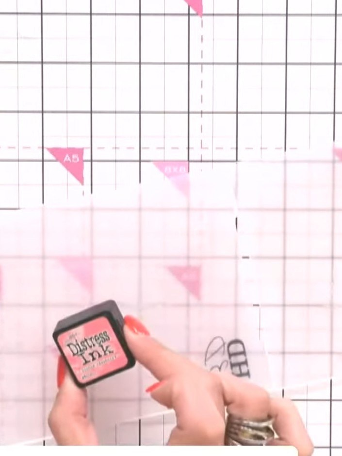 Step 1: Using a sponge applicator, ink up the embossing folder with pale pink Distress Ink, applying it to the raised 
