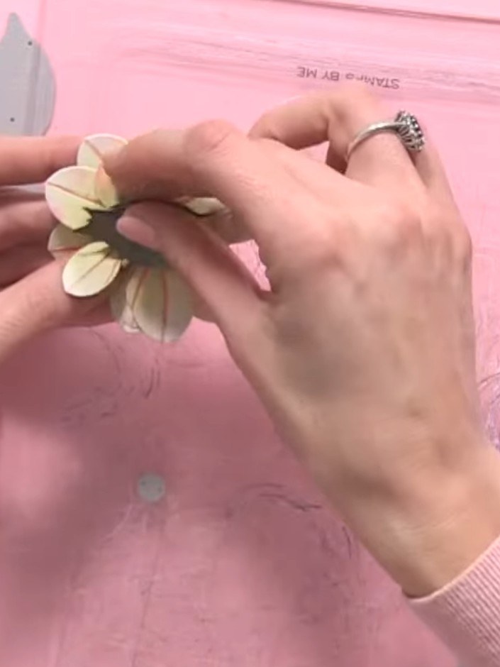 Step 9: Add the foliage elements between and around the flowers. Position the leaves to fill gaps and create a balance