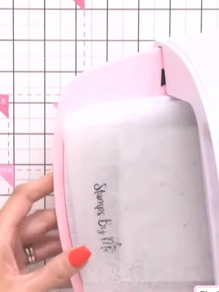 Step 4: Mount your holographic embossed piece onto a pink card base. Add a simple sentiment stamp to complete your cle