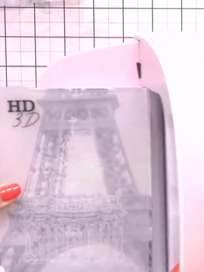 Step 1: Trim your patterned paper to fit through your embossing machine. Position the paper on your cutting mat and us