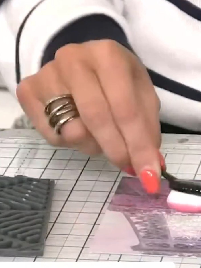 Step 4: Use a white ink pad to tap across the embossed Abbey detail, highlighting the raised areas to bring the design