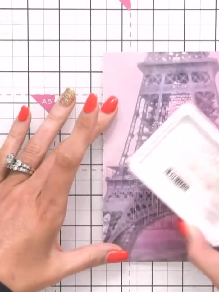 Step 6: Set the embossed Eiffel Tower piece aside to use as the background layer for your card.