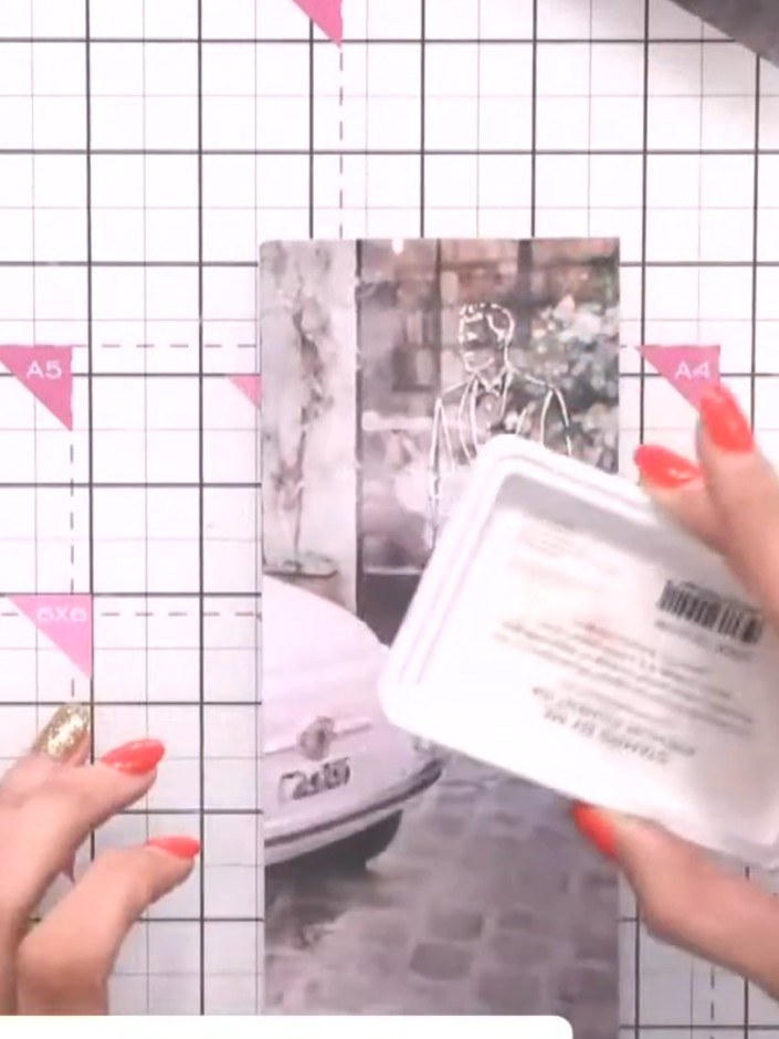 Step 3: Use a white ink pad to swipe across the embossed design on the vintage photograph. This will highlight Jasper 