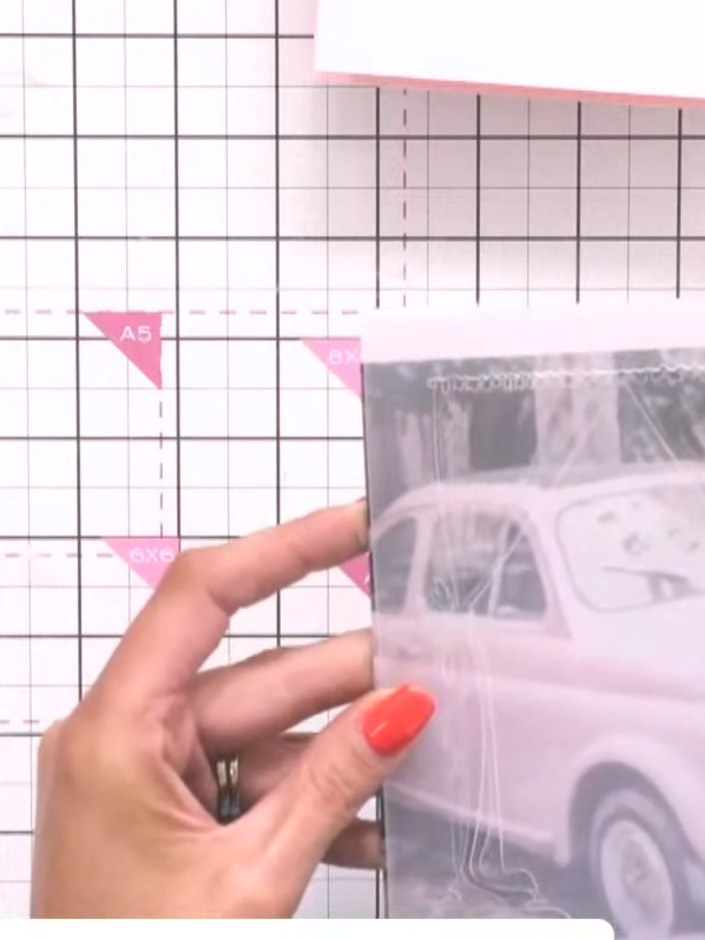 Step 1: Place the patterned paper featuring the vintage car image into the centre of the embossing folder.