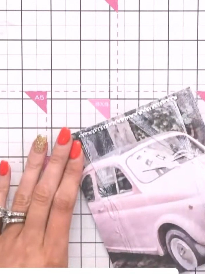 Step 4: Mount the embossed pink car image onto your pink card base. Position it centrally on the card front to create 
