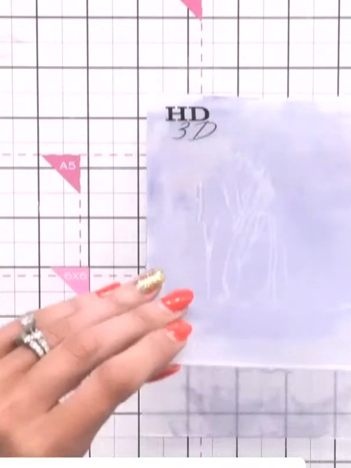 Step 1: Ink the HD 3D embossing folder with blue oxide ink, tapping the ink pad across both sides of the folder.
