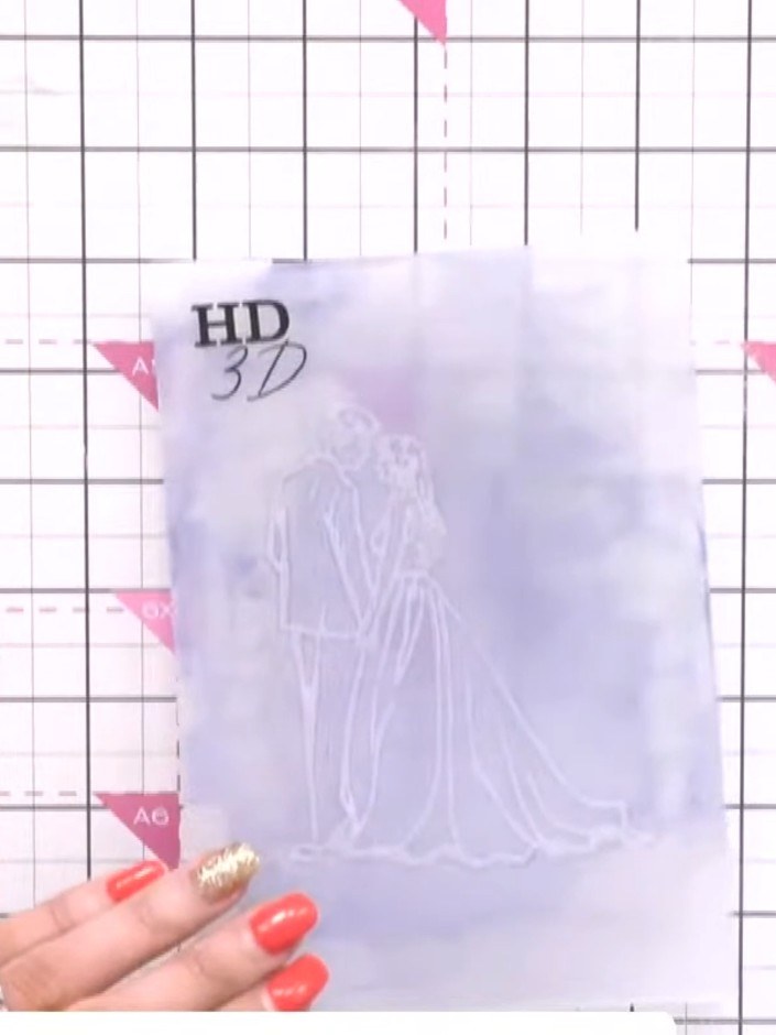 Step 2: Place the pearl card stock into the inked embossing folder. The folder should already have Distress Oxide ink 