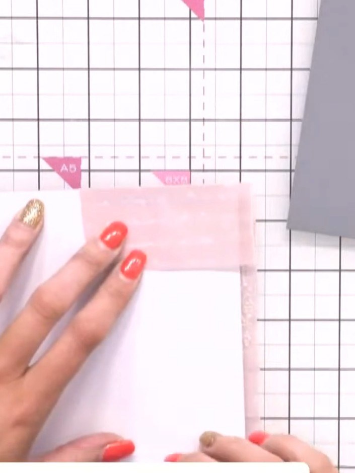 Step 7: Trim the excess vellum neatly around the edges of your mounted image using scissors. Chamfer the edges as you 