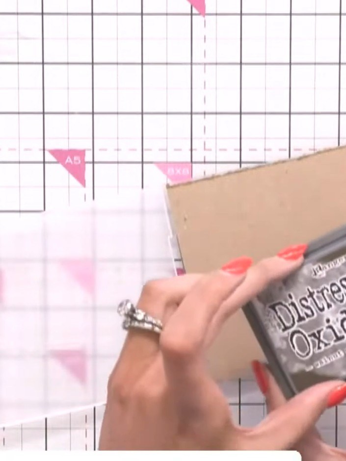 Step 1: Ink the easel embossing folder with walnut stain Distress Oxide ink. Tap the ink pad across both the top and b