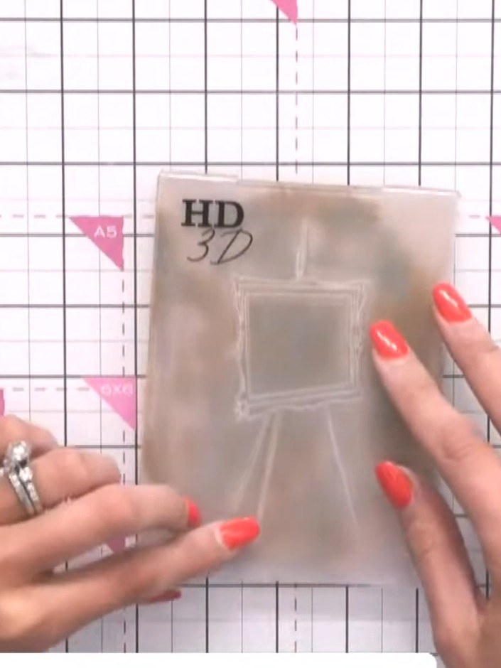 Step 5: Use a tissue to gently dab and lift colour from the embossed design on your card, creating a distressed, grung