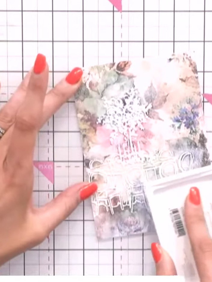 Step 6: Continue tapping and swiping the white ink pad over the entire embossed area of the mount. Work the ink into a