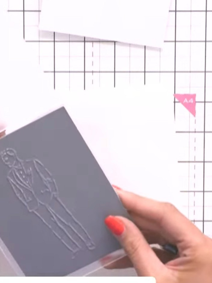 Step 3: Carefully fussy-cut around the exterior of the embossed Jasper gentleman design on the grey card. Follow the r