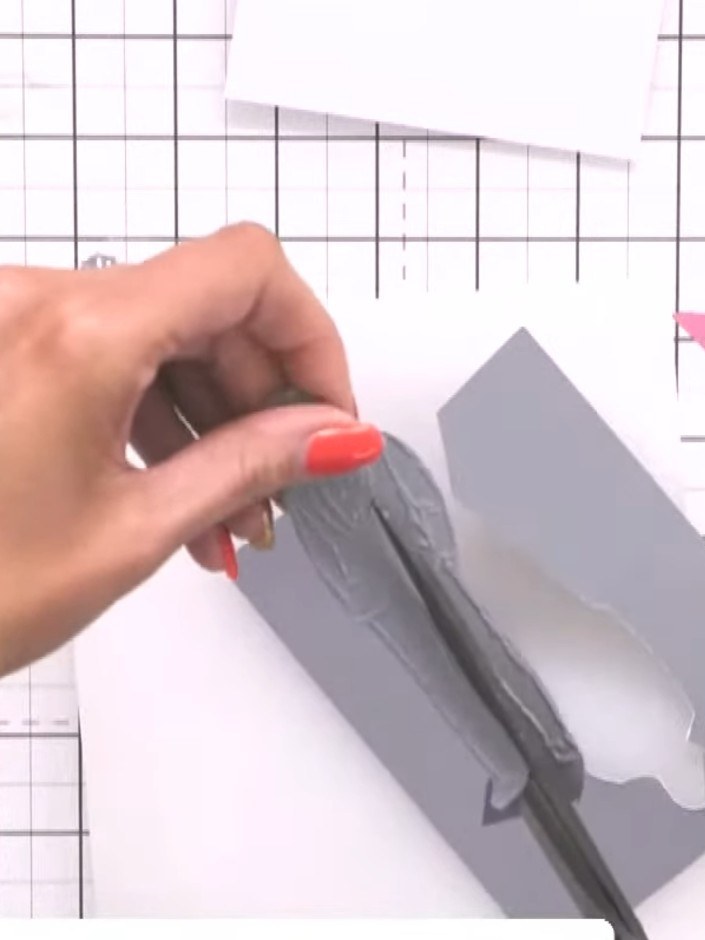 Step 5: Layer a piece of black card onto the grey card blank base. Position the black card centrally on the grey card 