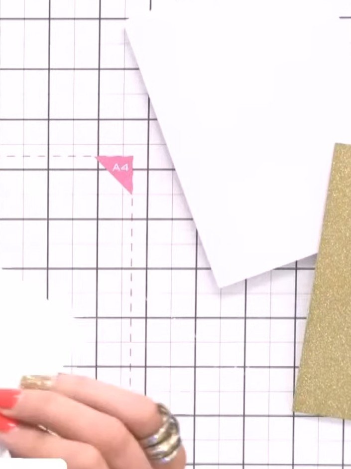 Step 3: Carefully fussy-cut around the gilded frame from the gold glitter card. Cut out and remove the interior sectio