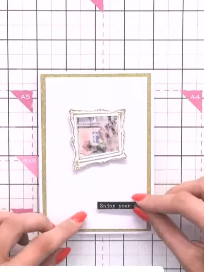 Step 8: Add a sentiment on a washi tape tab to the side of the card. Position the tab near the bottom edge of the gold