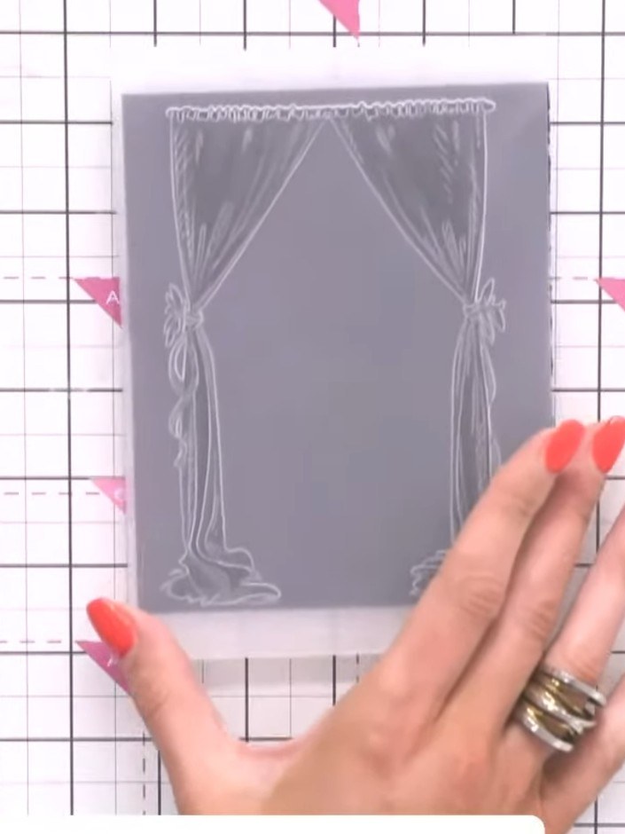 Step 1: Place your black card stock into the Cabaret Curtains embossing folder, ensuring it is positioned centrally wi