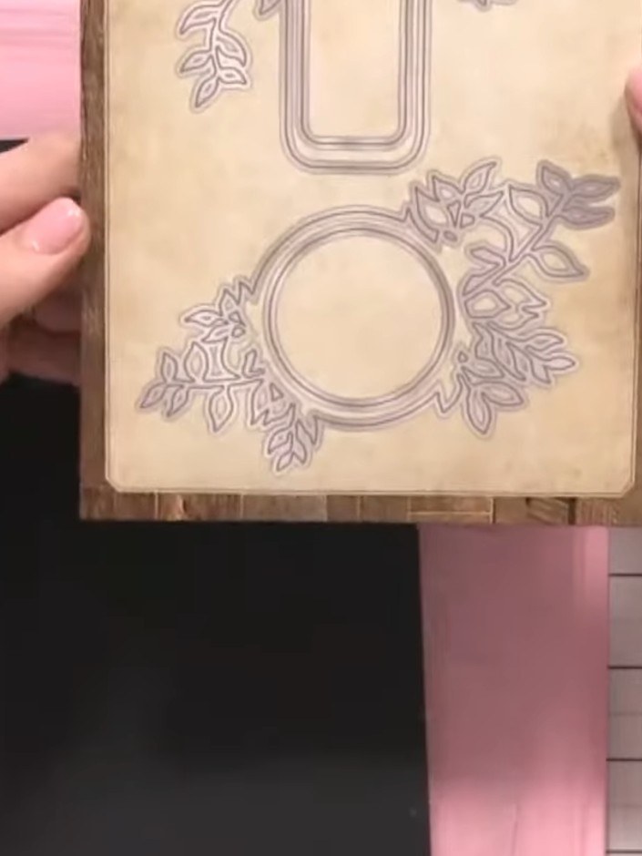Step 3: Position the floral banner die plate on the black cardstock. Secure it in place using low-tack tape or hold it