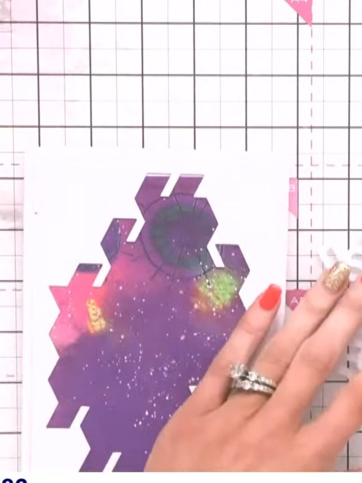 Step 11: Arrange the die-cut floral elements on your chevron background panel, positioning them in the corner to create