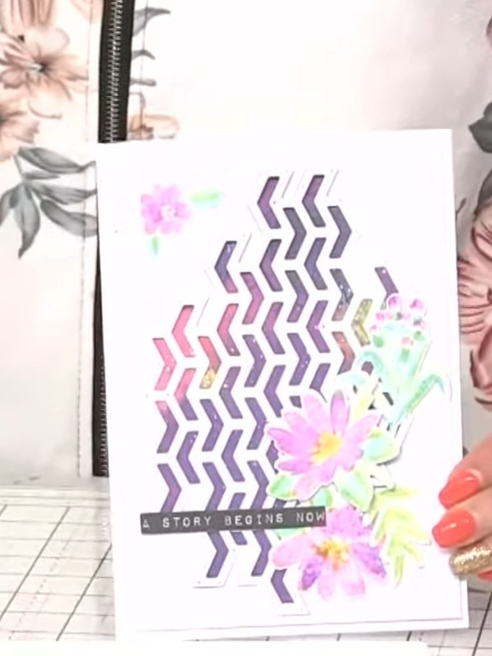 Step 12: Add a sentiment stamp to the bottom of the card. Use a phrase such as 'A story begins now' to complete your wa