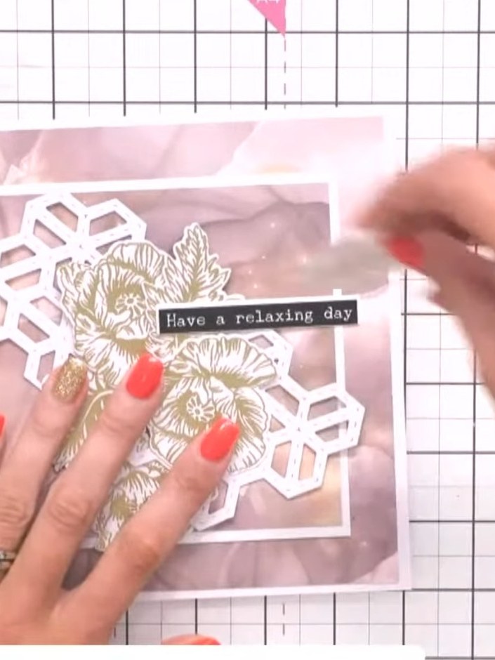 Step 10: Adhere a black Washi tape strip horizontally across the centre of the card. Add a sentiment such as 'Have a re
