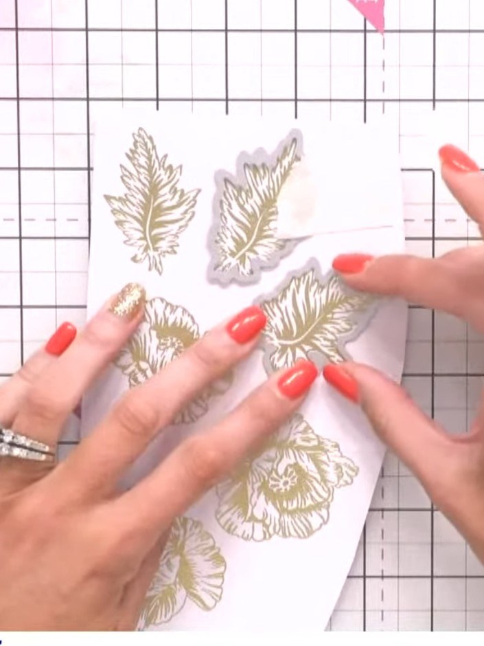 Step 5: Stamp the Poppy Haze floral designs onto white card stock using black ink. Position the stamps to create an at