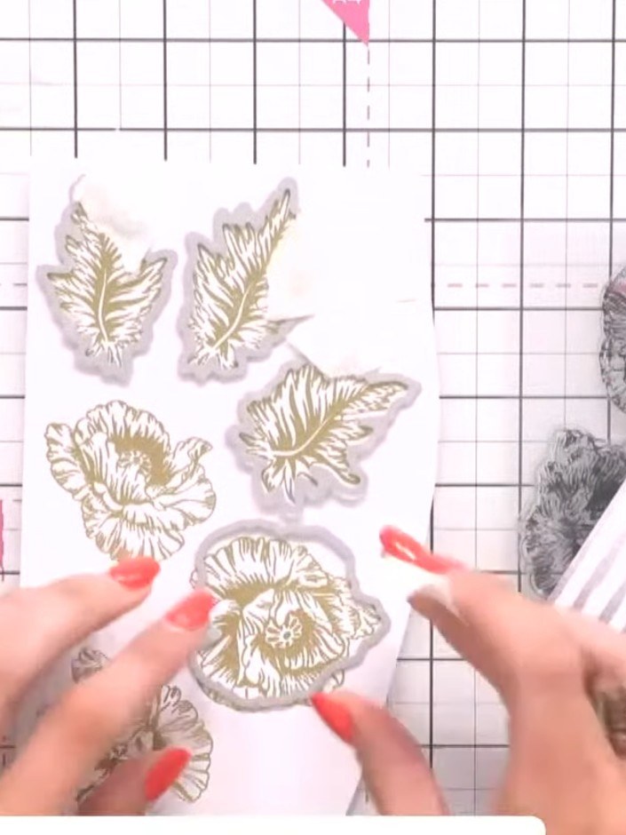 Step 6: Heat emboss the stamped poppy images using gold embossing powder. Apply embossing powder to the stamped design