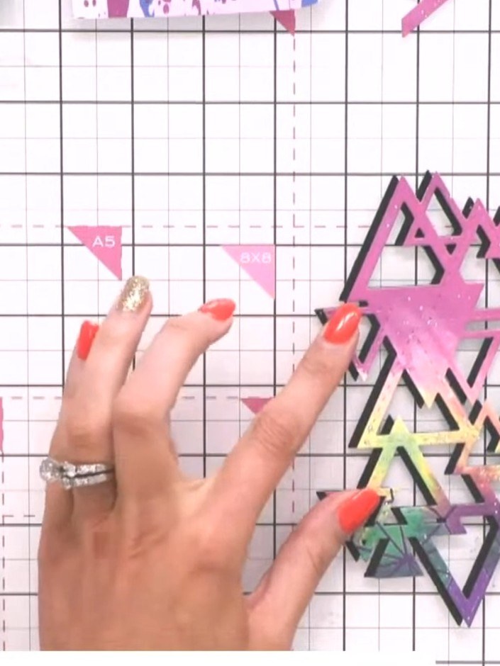 Step 4: Layer the coloured triangle piece on top of the black outline version, offsetting it slightly to create a drop
