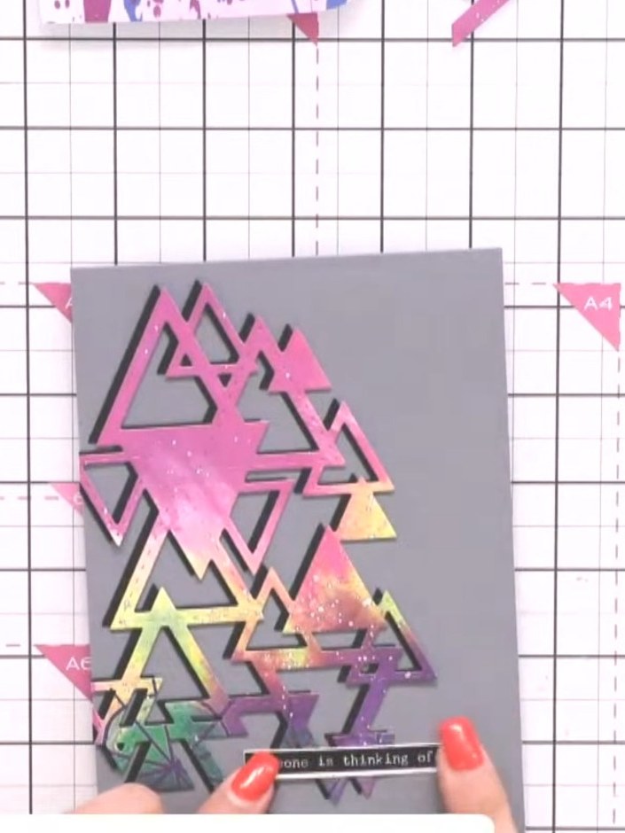 Step 8: Add a washi tape sentiment to the card. Position it towards the bottom of the triangles design to complete you