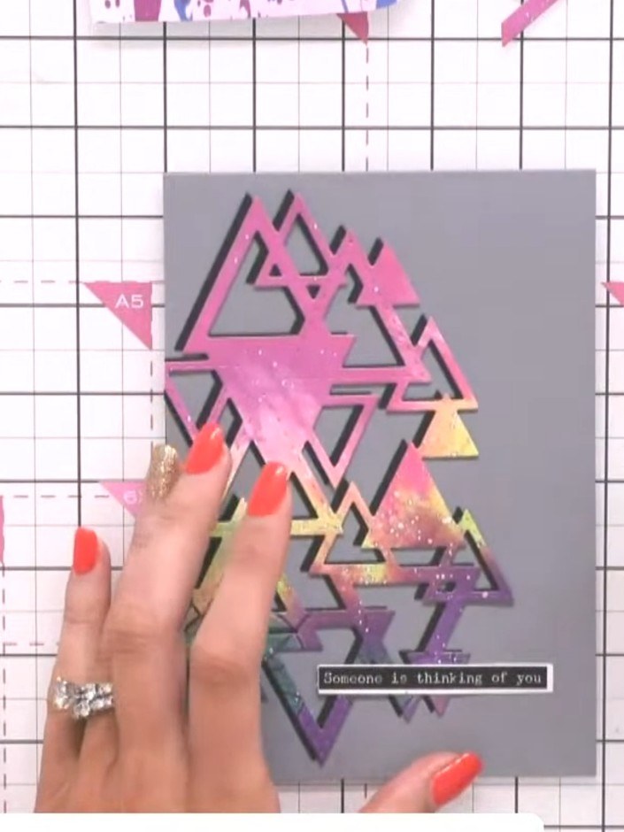 Step 9: Apply media glitter over the triangles to add sparkle and create a glass-like finish. The glitter will enhance