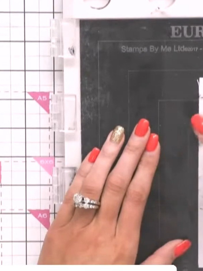 Step 4: Stamp 'Reveal here' or 'Scratch here' onto the tag using the appropriate stamp from the set to indicate where 