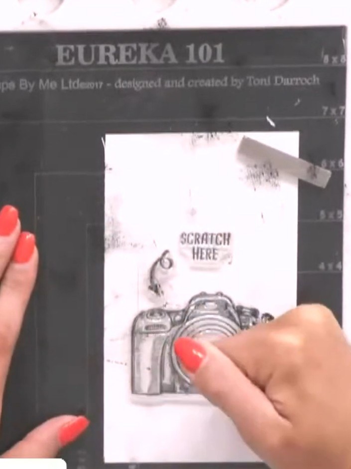 Step 5: Stamp a directional arrow pointing to the scratch area on the tag. Use the arrow stamp to indicate where to sc