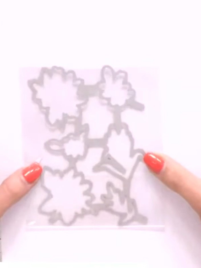 Step 3: Line up the third stamp layer by aligning the central heart with the previously stamped image. Ink the stamp a