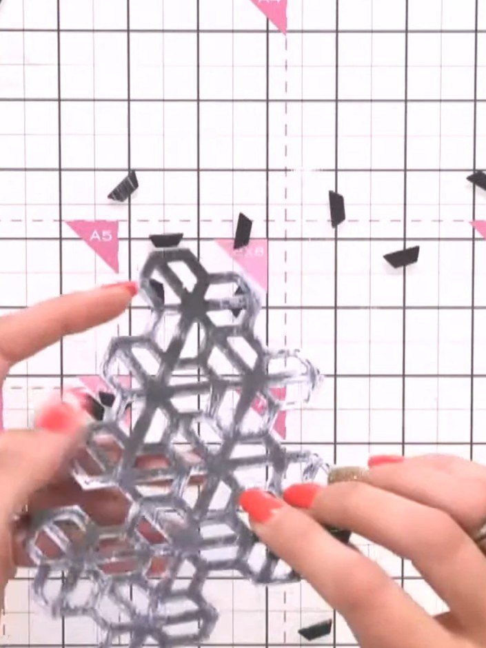 Step 2: Pop out the die-cut hexagon mosaic design from the silver mirror card, carefully releasing all the individual 